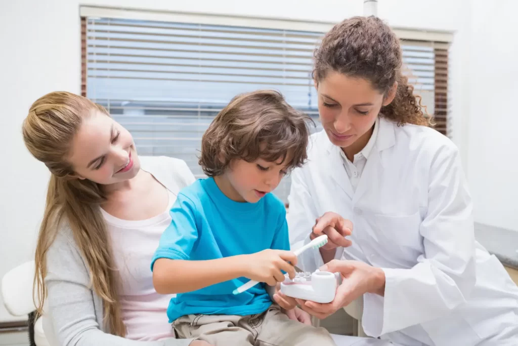 Healthcare professional demonstrating dental care at Calgary medical centre & walk in clinic